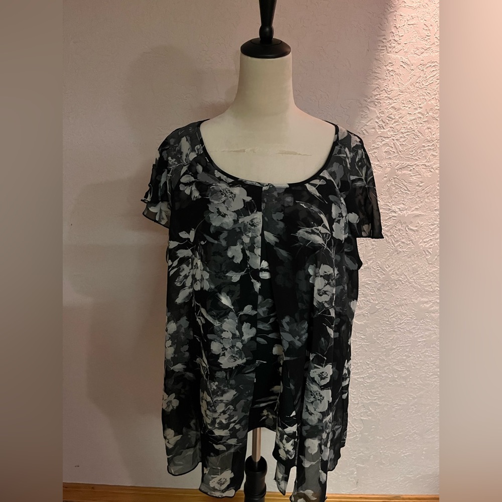 Black, gray floral blouse with an upside down V neck layer.